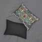 A rectangular lumbar cushion with a William Morris & Co floral and geometric pattern in multiple colours, including blue, beige, and green, with a concealed beige zipper.