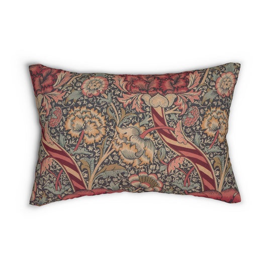 A rectangular lumbar cushion with a red and green William Morris & Co floral pattern on a textured background, featuring a concealed beige zipper.