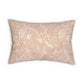 A rectangular decorative throw pillow featuring a classic damask floral pattern in soft blush pink and cream on a warm beige background, shown against a plain white studio backdrop.