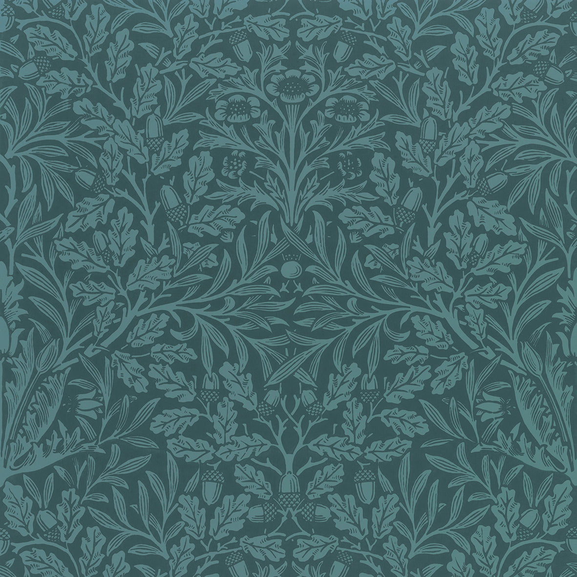 A rectangular lumbar cushion with a William Morris & Co floral pattern in teal colour, featuring acorn and oak leaves.