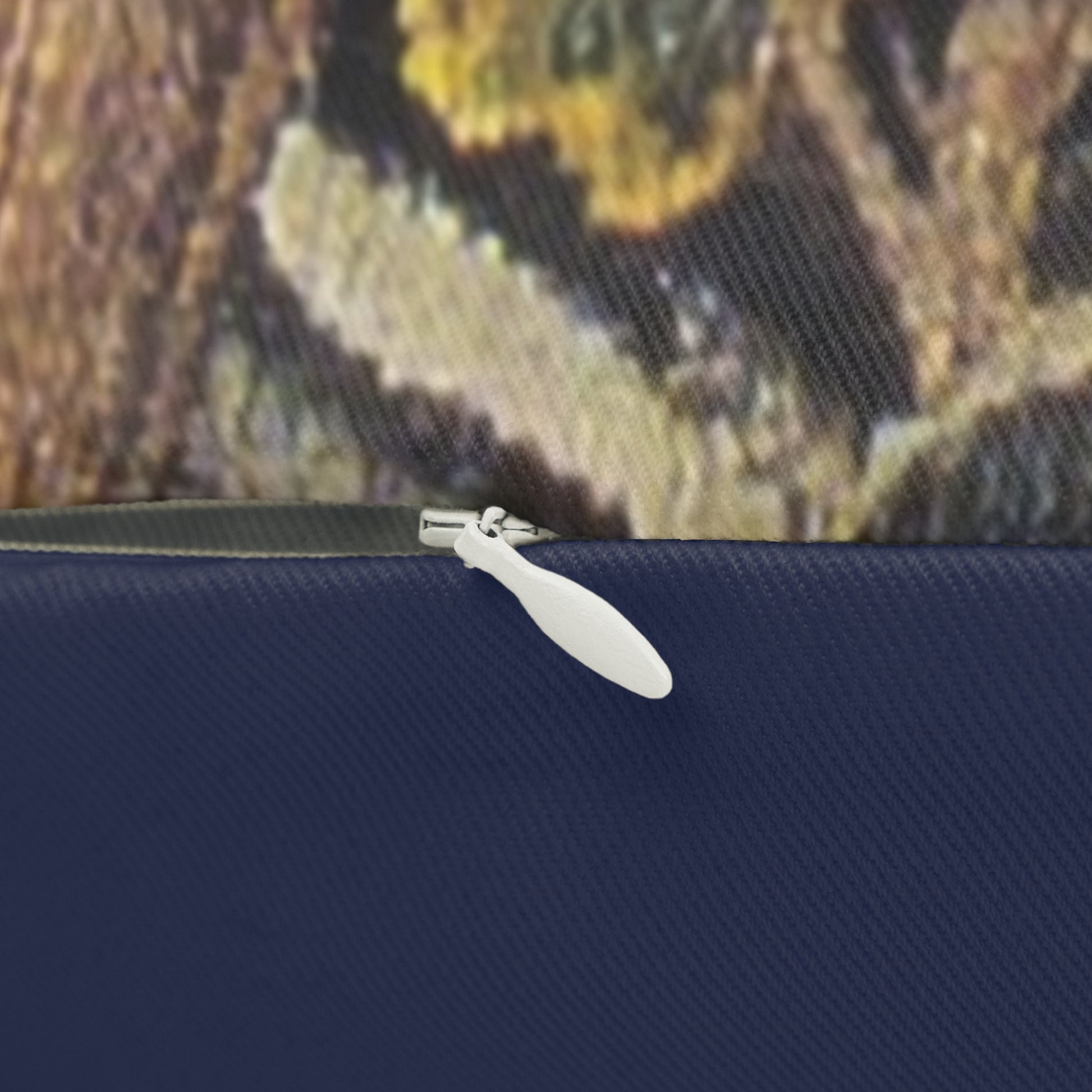 A decorative lumbar cushion featuring a historical floral and wildlife design inspired by William Morris.