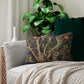 A decorative lumbar cushion featuring a historical floral and wildlife design inspired by William Morris.
