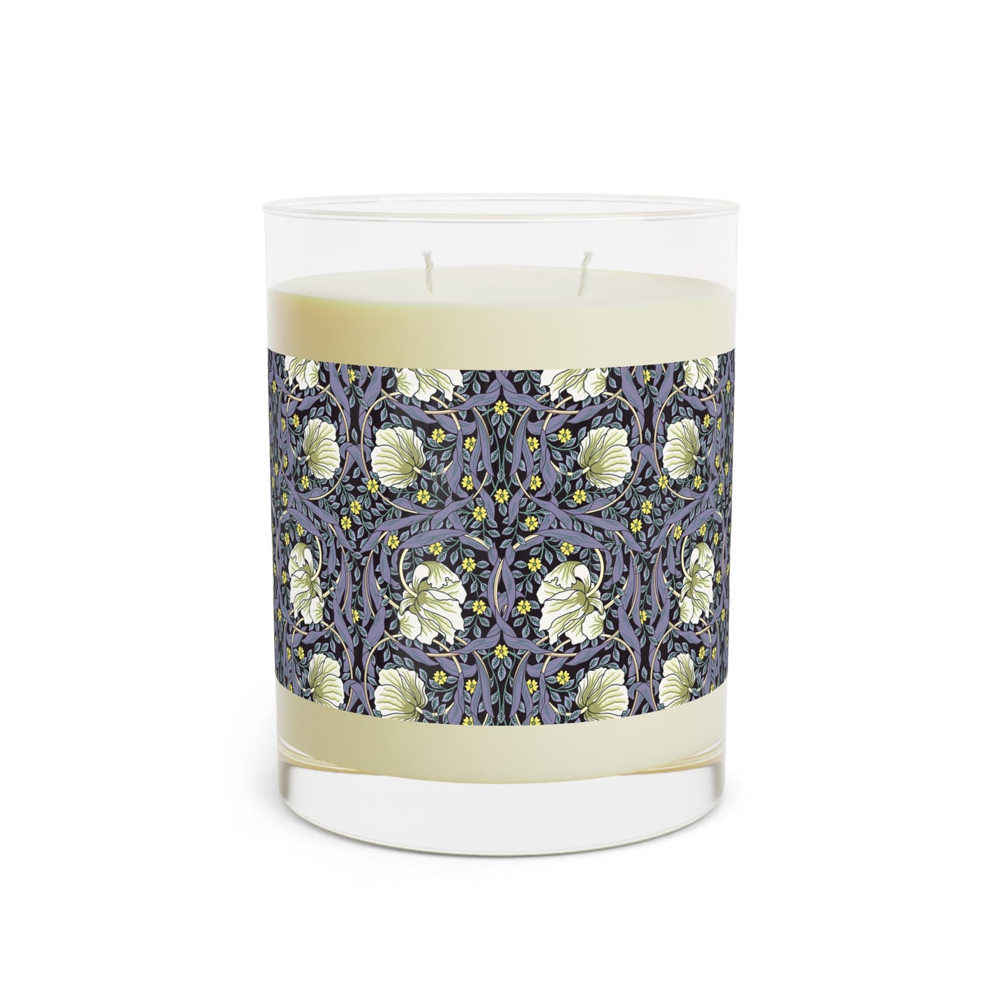 A clear candle with a lavender and sage William Morris & Co design called Pimpernel on the glass lid, alongside a brown cardboard lid with product information.