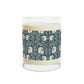 A clear glass candle with a William Morris & Co floral patterned lid and a label that reads 'Seventh Ave White Tea & Fig' alongside a brown cardboard lid.