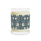 A clear glass candle with a William Morris & Co floral patterned lid and a label that reads 'Seventh Ave White Tea & Fig' alongside a brown cardboard lid.