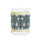 A clear glass candle with a William Morris & Co floral patterned lid and a label that reads 'Seventh Ave White Tea & Fig' alongside a brown cardboard lid.