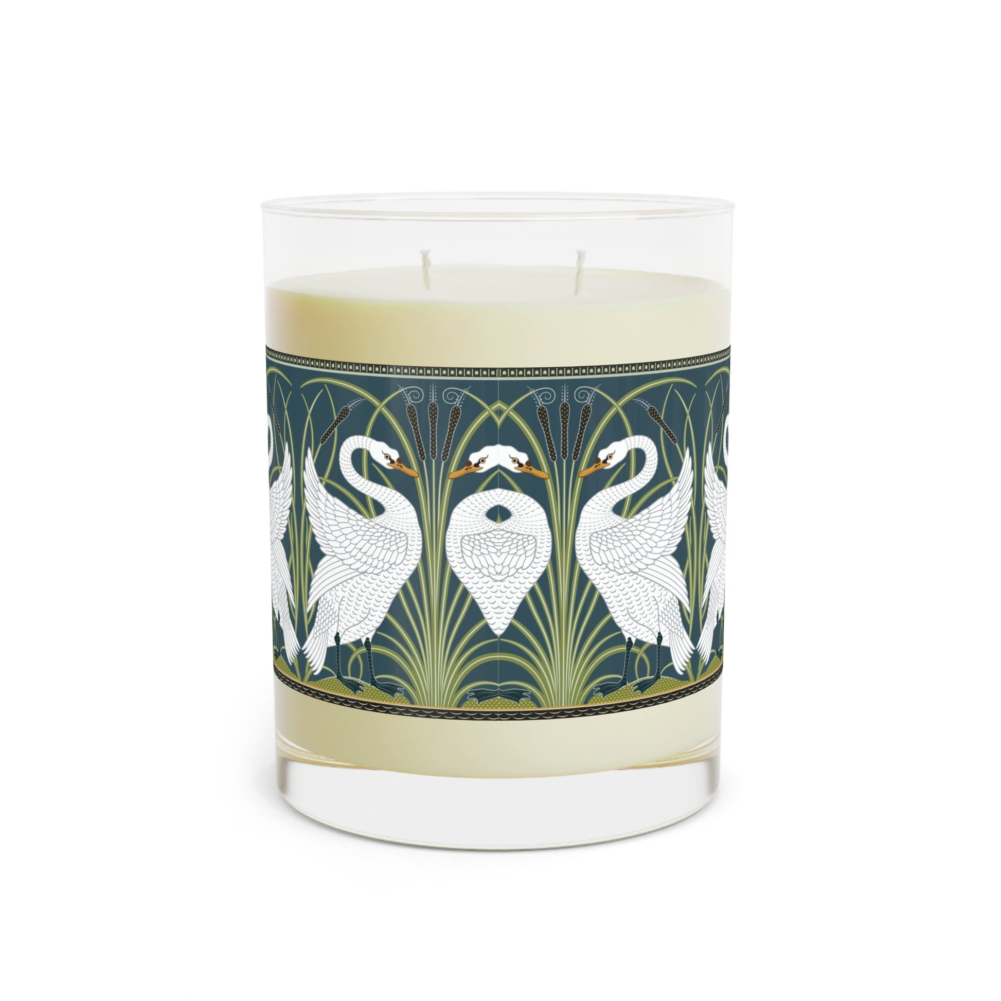 A clear glass candle with a white swan design on the label, alongside a brown cardboard lid with text.