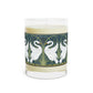 A clear glass candle with a white swan design on the label, alongside a brown cardboard lid with text.