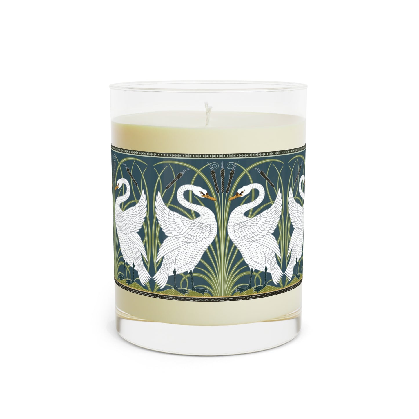 A clear glass candle with a white swan design on the label, alongside a brown cardboard lid with text.