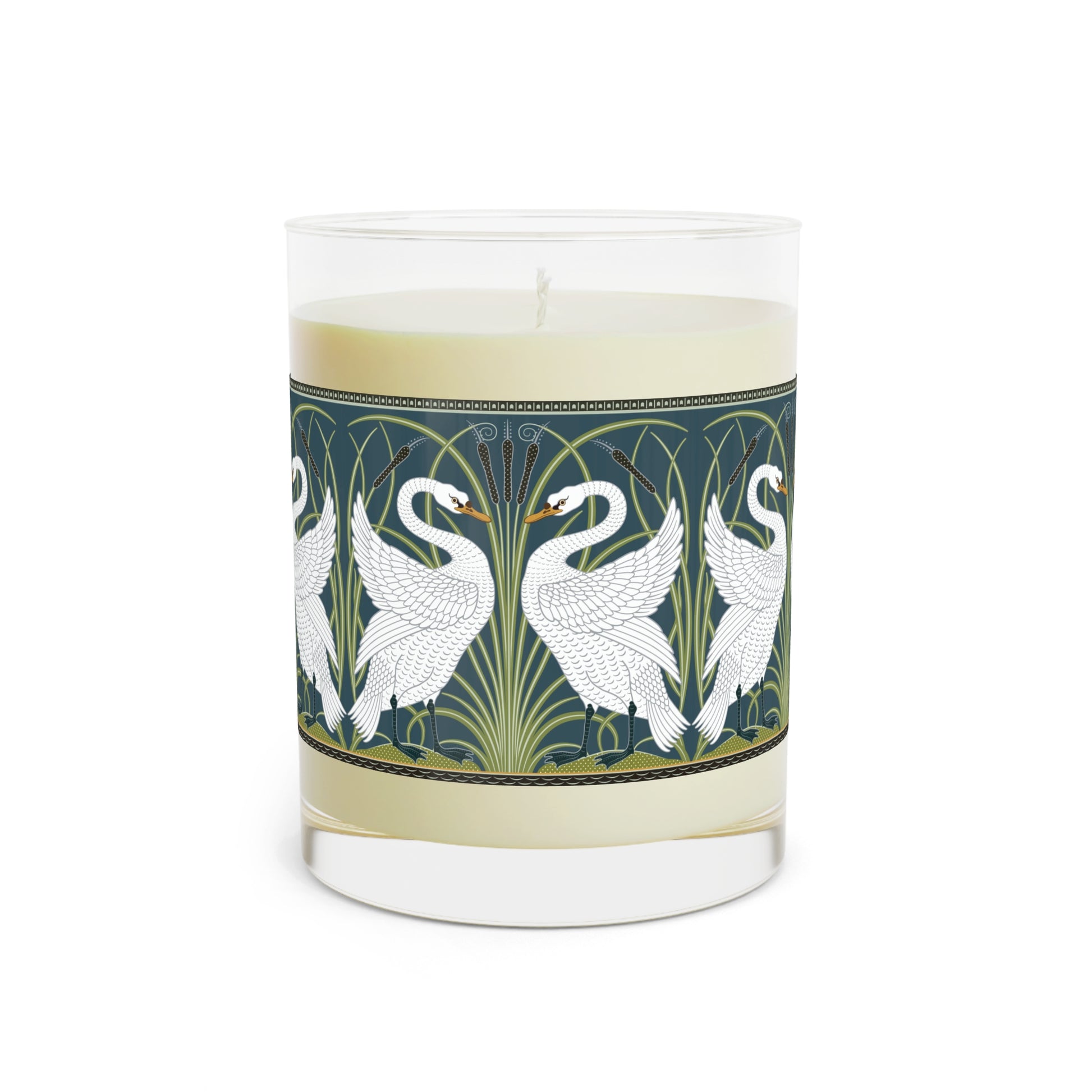 A clear glass candle with a white swan design on the label, alongside a brown cardboard lid with text.