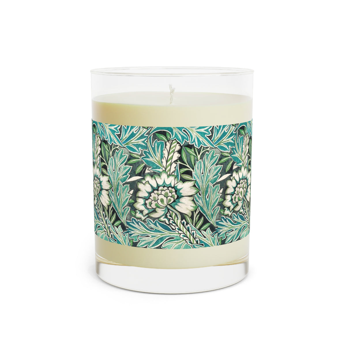 A single-wick candle in a clear glass jar with cream-colored wax and a decorative paper band featuring a teal, green, and white floral pattern, shown on a plain white background.