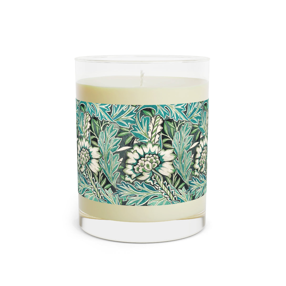 A clear glass jar candle with cream-colored wax and a decorative label featuring a teal, green, and white botanical pattern, shown on a plain white background.
