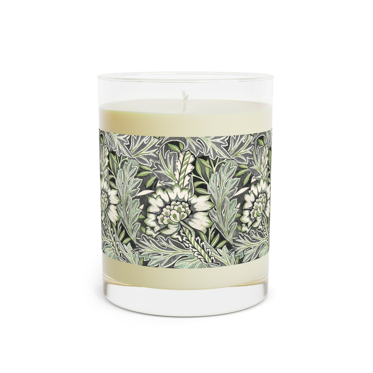 A glass jar candle with cream-colored wax and a detailed botanical label featuring green and white leaves and flowers, set against a plain white background.