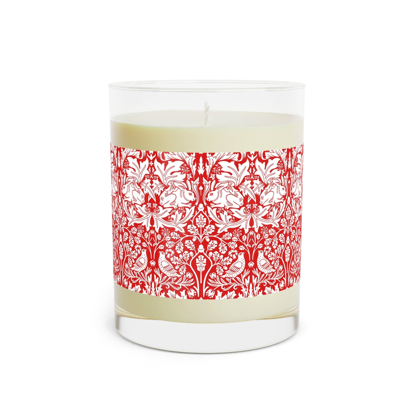 Candle with red floral pattern and wooden lid on a white background