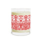 Candle with a red and white patterned label on a white background