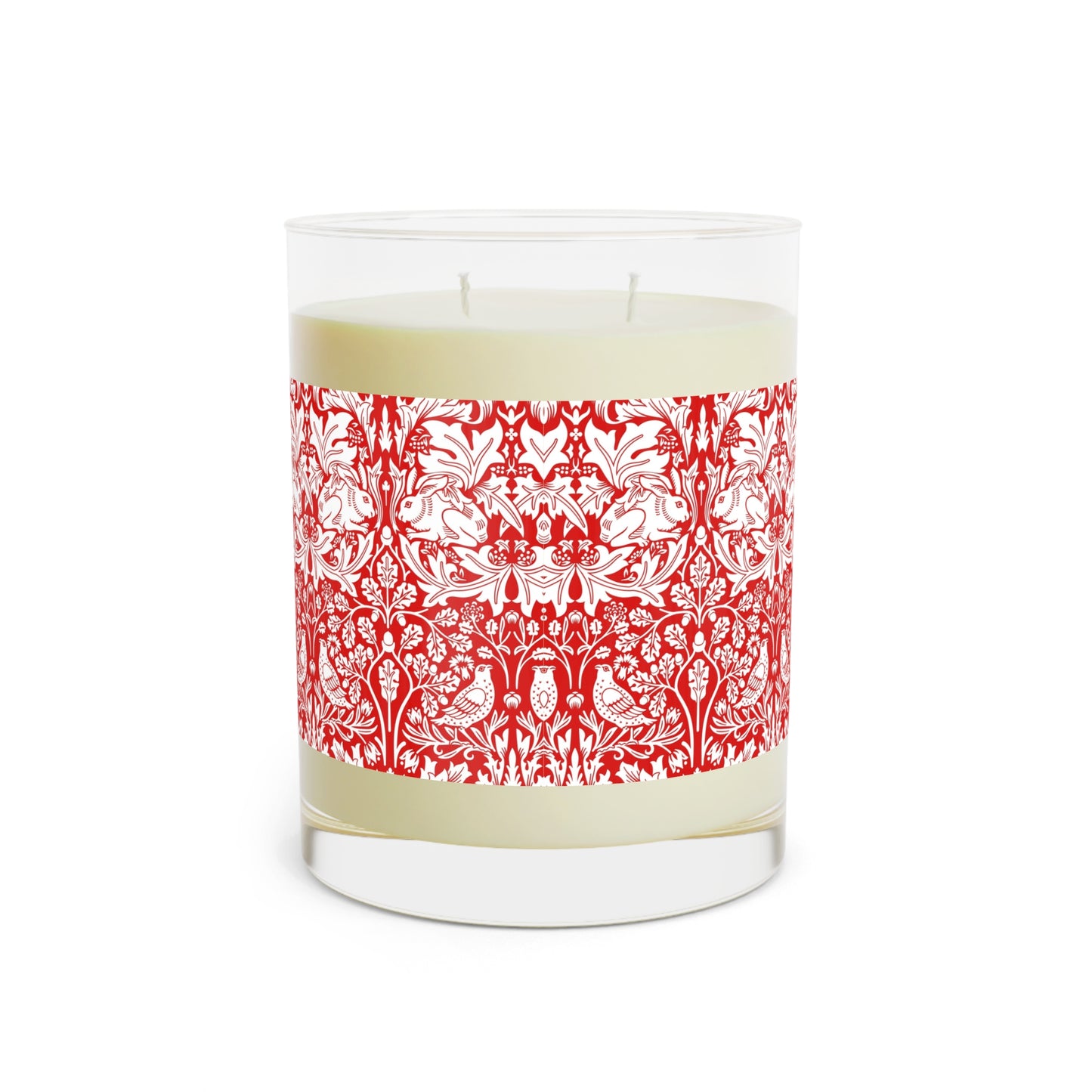 Candle in a glass jar with a red and white pattern on a white background