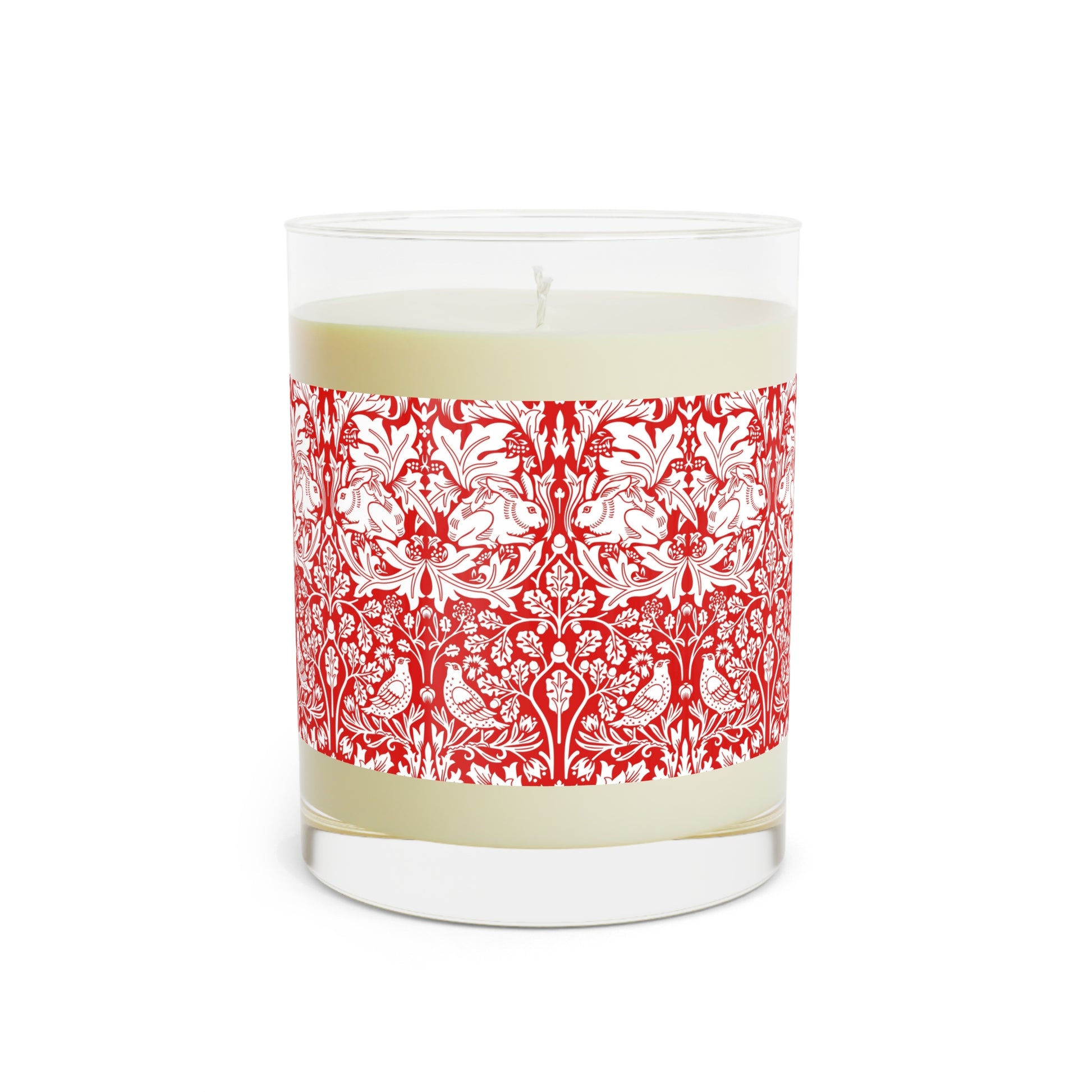 Candle with a red and white patterned label on a white background