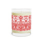 Candle with a red and white patterned label on a white background