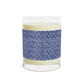Candle in a glass jar with blue patterned band on a white background