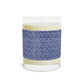 Candle with a blue patterned band on a white background