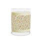 Candle with floral patterned label on a white background
