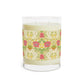 Candle with floral patterned label on a white background