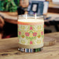 Candle with a decorative label on a wooden surface