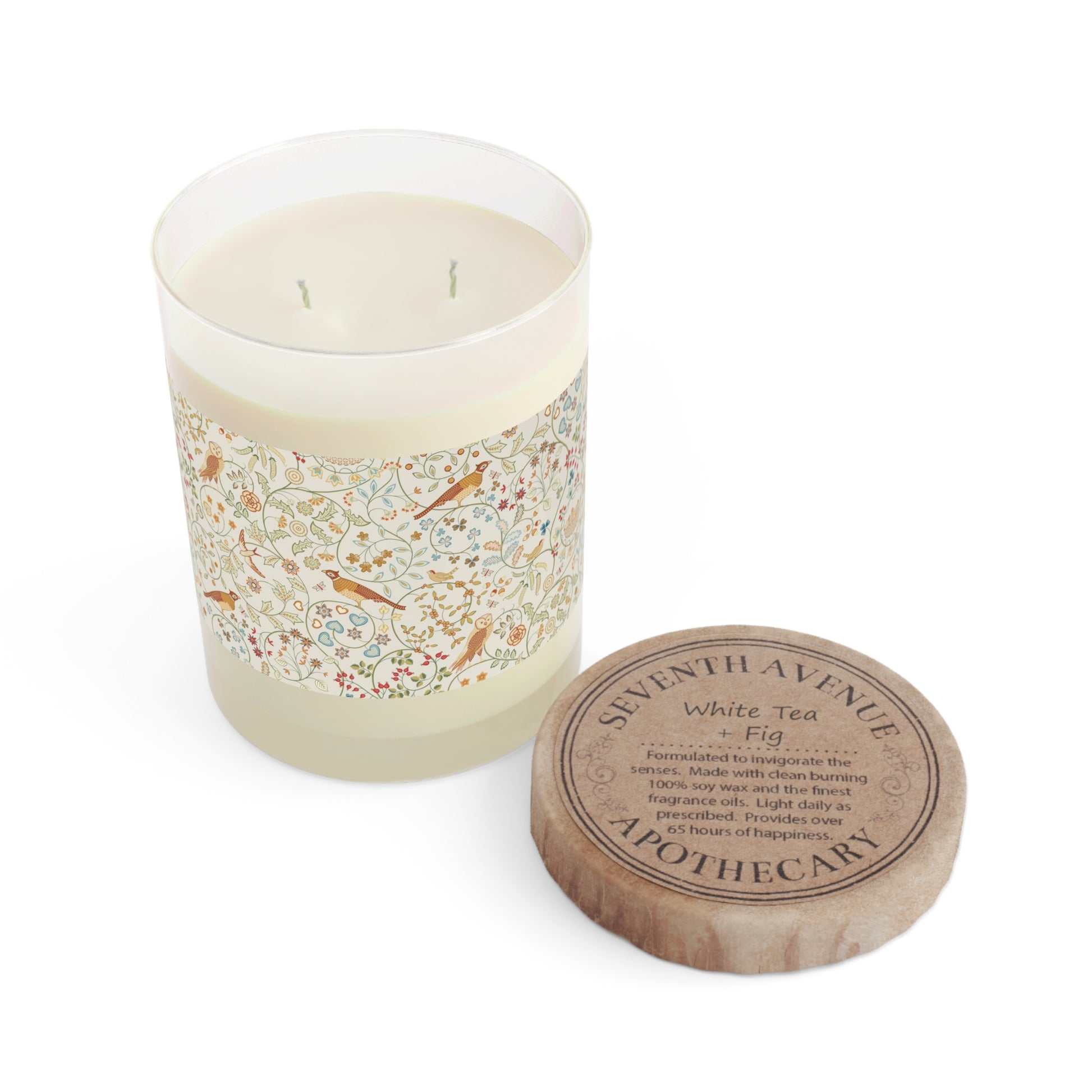 Candle with floral design and wooden lid on a white background