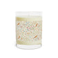 Candle with decorative label on a white background