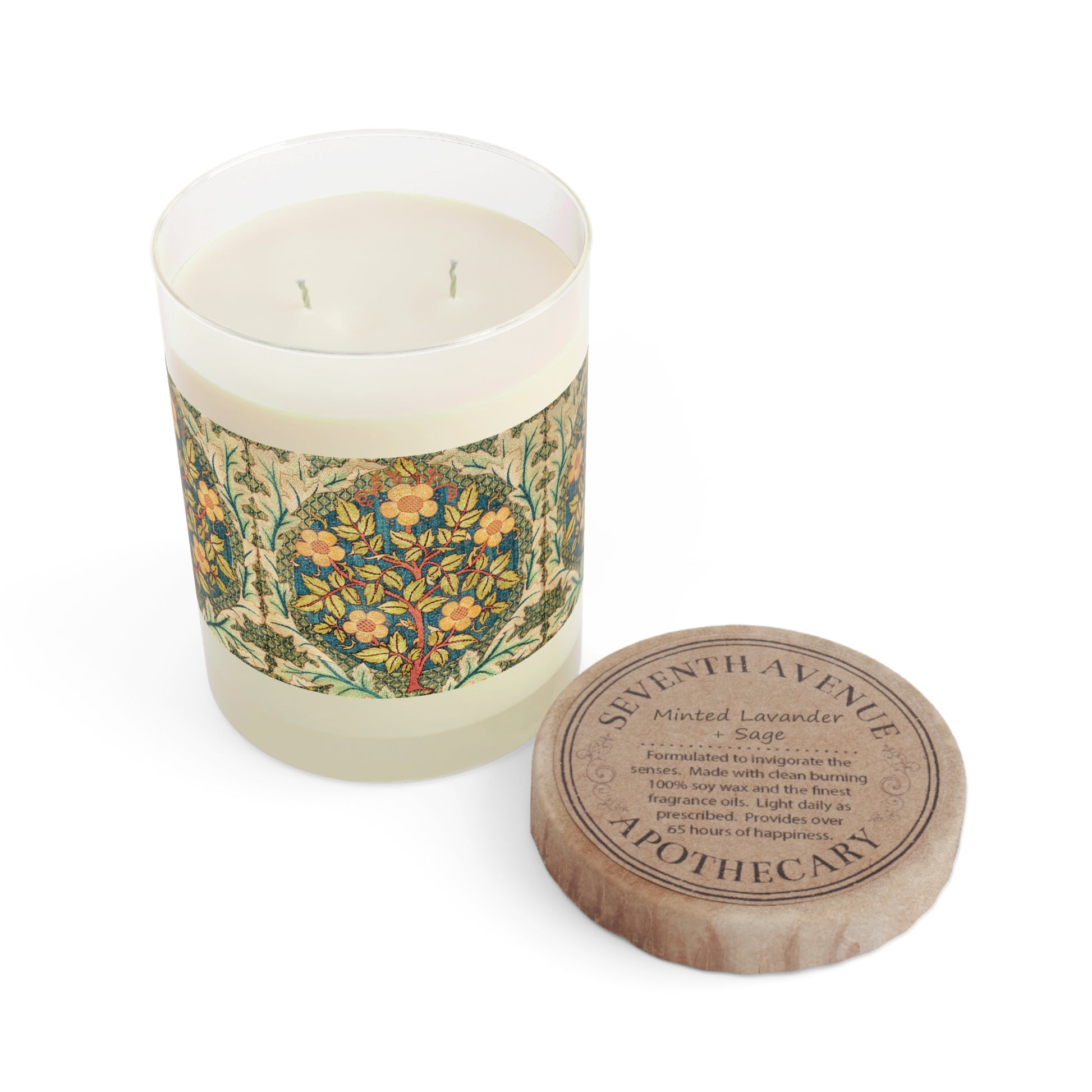 A luxury scented candle with a William Morris & Co floral pattern wrapping around the glass jar, alongside a brown cardboard lid.