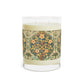 A luxury scented candle with a floral pattern wrapping around the glass jar, alongside a brown cardboard lid.