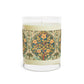 A luxury scented candle with a William Morris & Co floral pattern wrapping around the glass jar, alongside a brown cardboard lid.