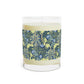 A William Morris & Co luxury scented candle in a glass jar with blue seaweed floral patterns,