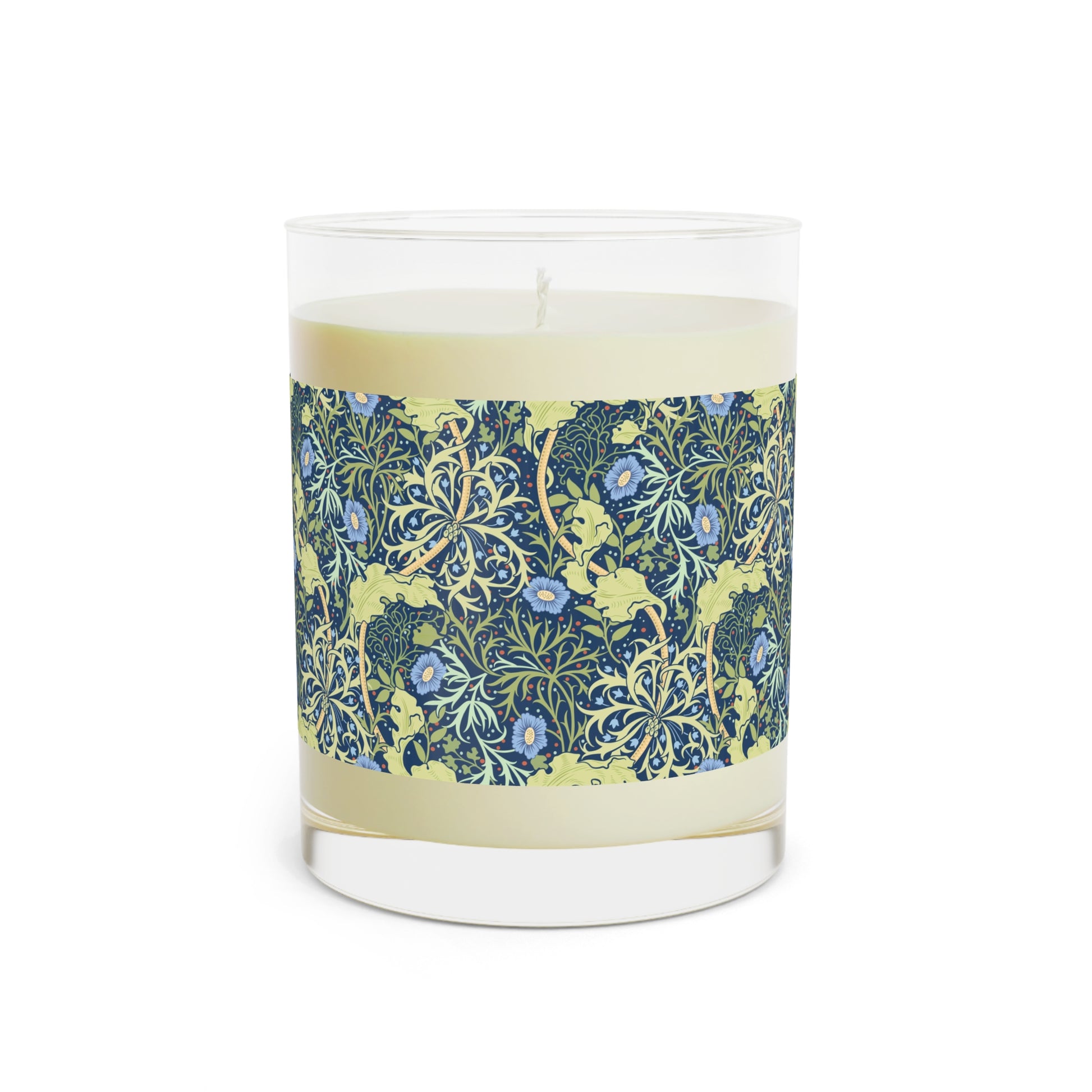 A William Morris & Co luxury scented candle in a glass jar with blue seaweed floral patterns,