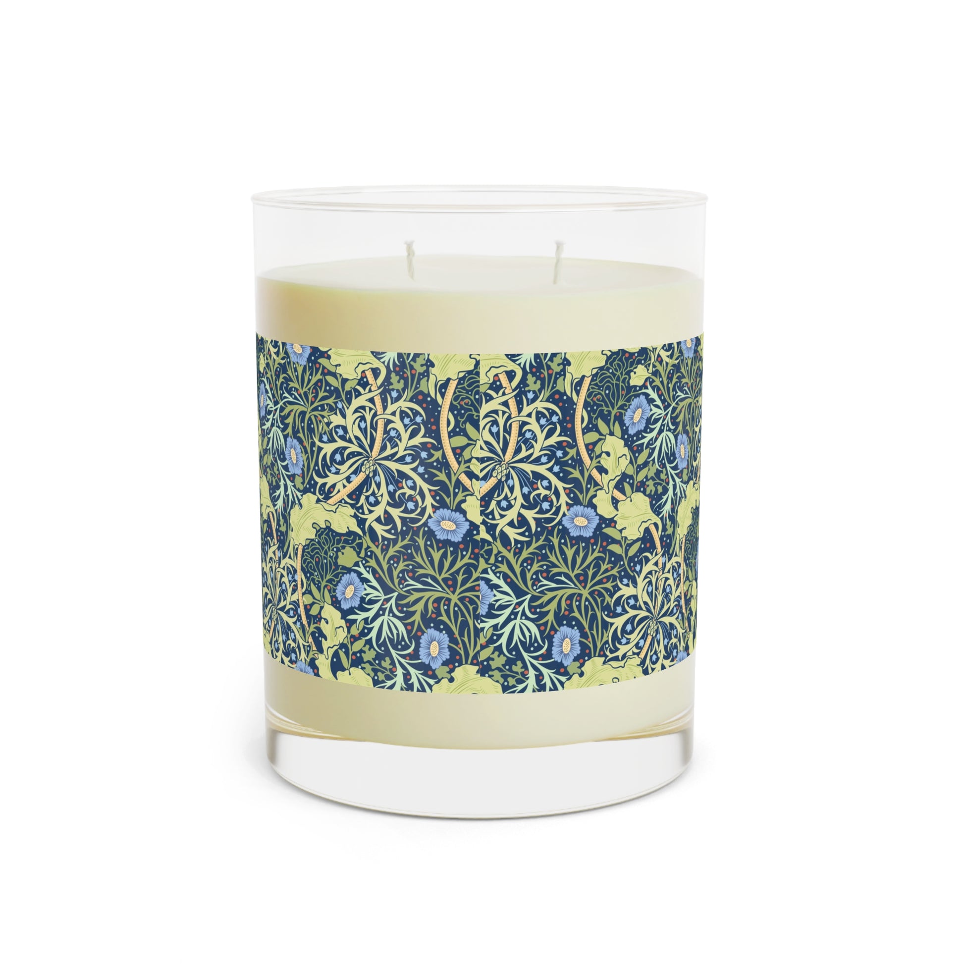 A William Morris & Co luxury scented candle in a glass jar with blue seaweed floral patterns,