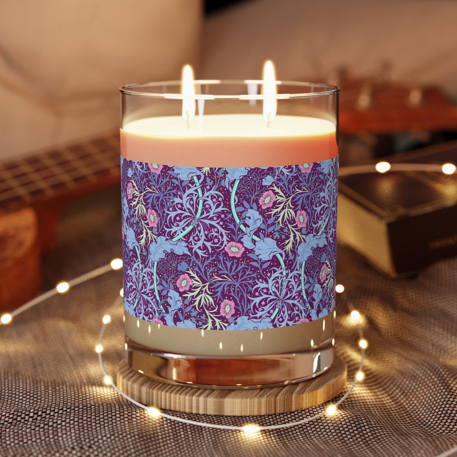 William Morris & Co luxury scented candle in a white jar with a floral Seaweed pattern, accompanied by a brown cardboard lid.
