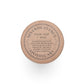 Round cardboard container with text 'Seventh Avenue Apothecary' and 'Ocean Mist + Moss'.
