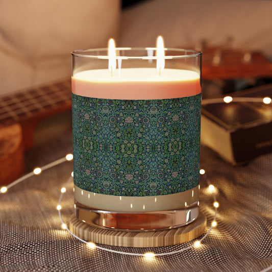 A clear glass luxurious scented candle with a geometric multicolour William Morris & Co pattern lid from a Arts & Crafts pattern called Violet & Columbine