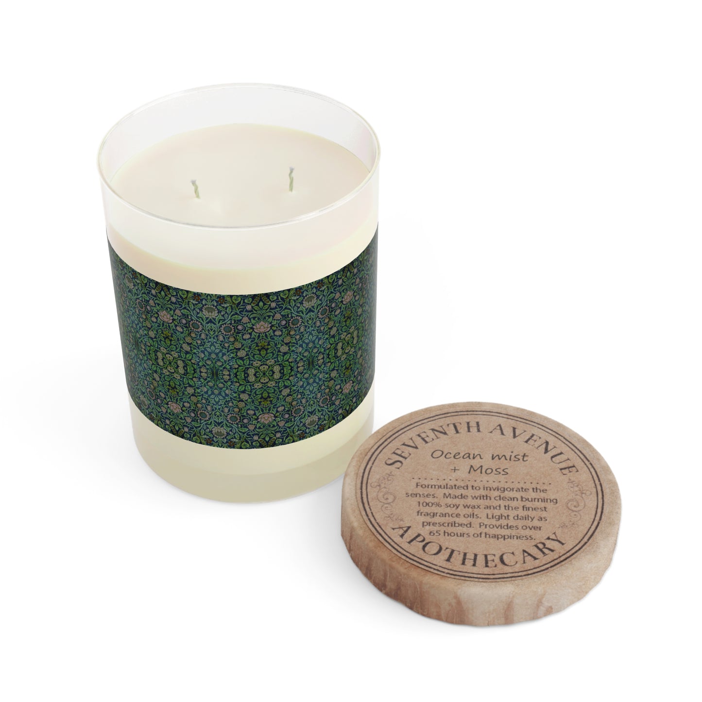 A clear glass luxurious scented candle with a geometric multicolour William Morris & Co pattern lid from a Arts & Crafts pattern called Violet & Columbine