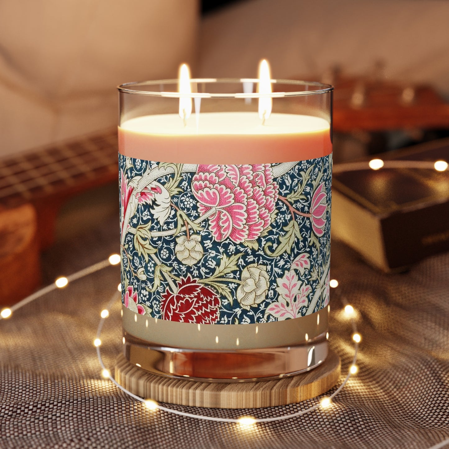 Luxury Scented Candle in a glass jar with a brown paper lid inspired by William Morris  & Co in an Arts & Crafts pattern called Cray with pink and blue flowers