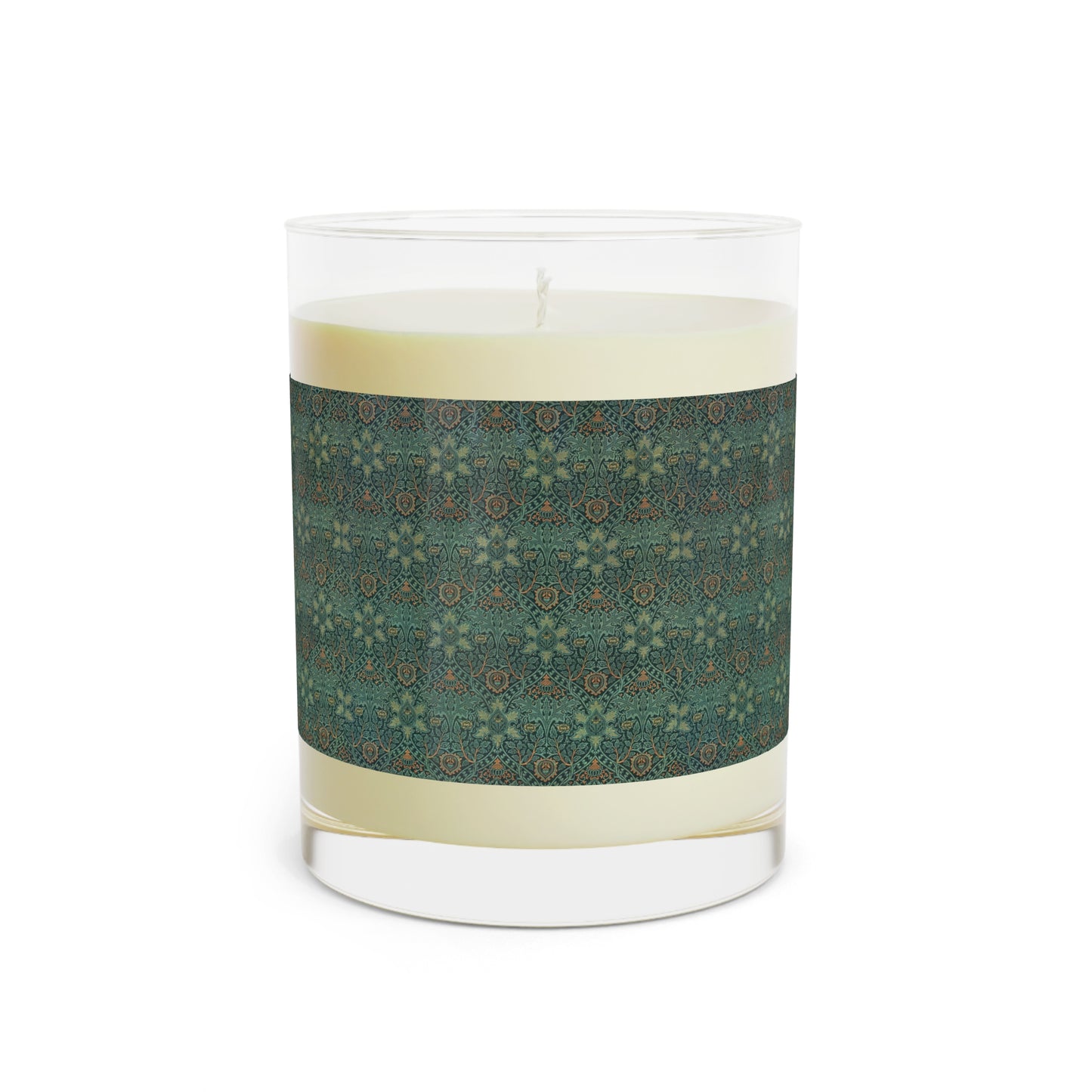 A clear glass candle with a brown and green floral pattern called Ispahan from William Morris & Co with a brown wick and a small round brown cardboard lid on top.