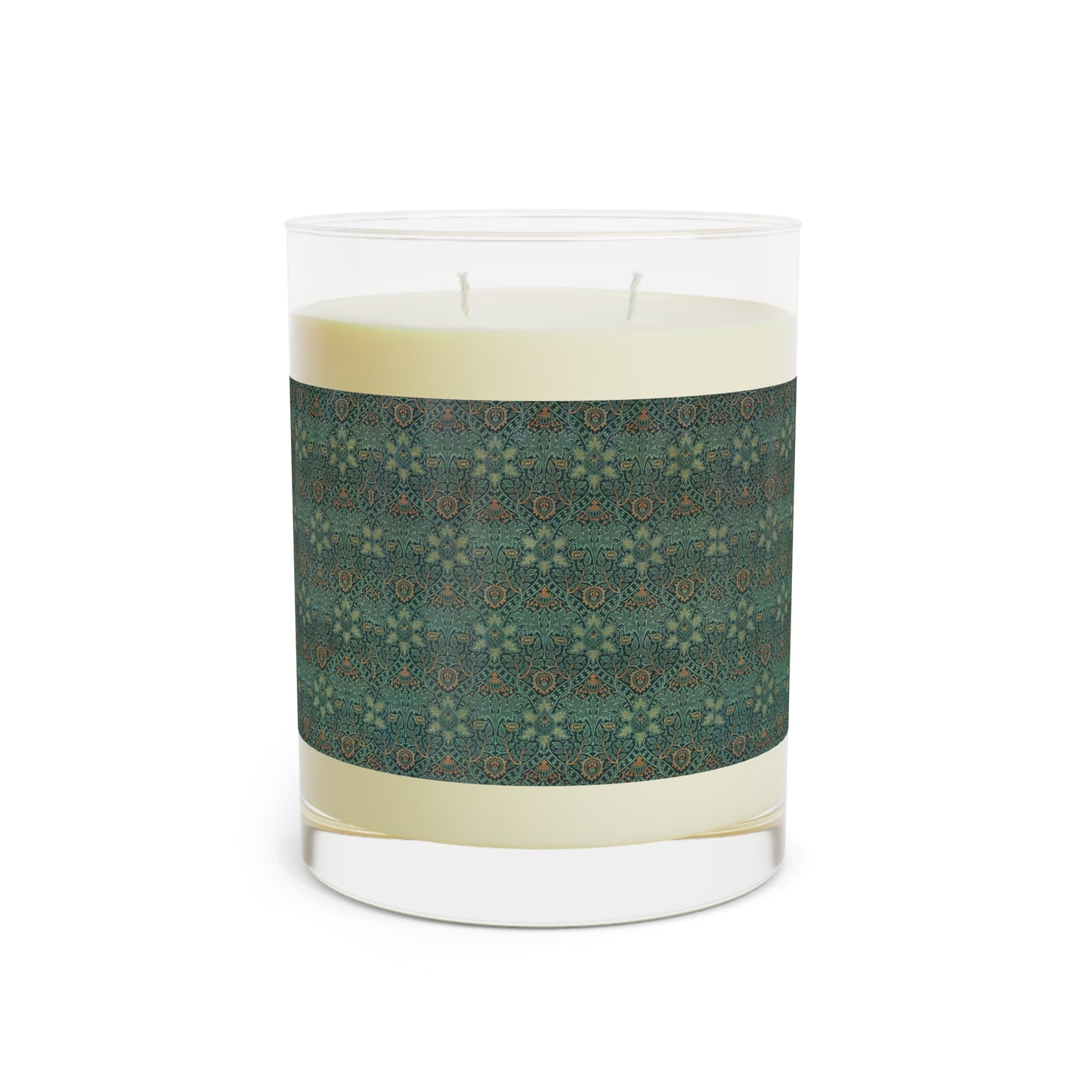 A clear glass candle with a brown and green floral pattern called Ispahan from William Morris & Co with a brown wick and a small round brown cardboard lid on top.