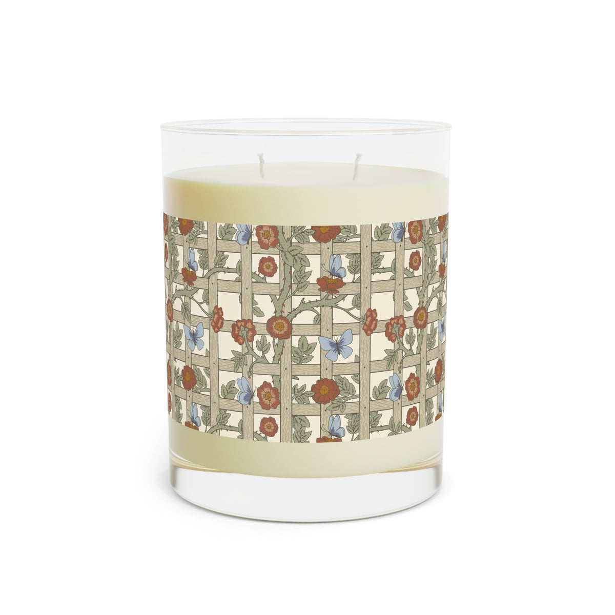 A two-wick scented candle in a clear glass jar, featuring a cream-colored wax body and a decorative paper label with a floral trellis pattern in muted red, blue, and green tones.