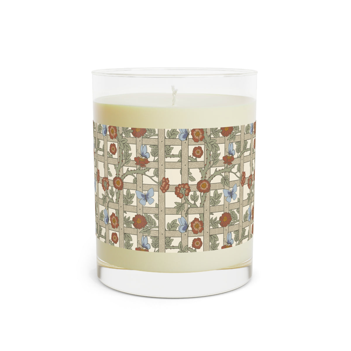 A clear glass jar candle with pale cream wax and a wraparound floral trellis pattern label in beige, rust red, green, and light blue, shown on a white background.