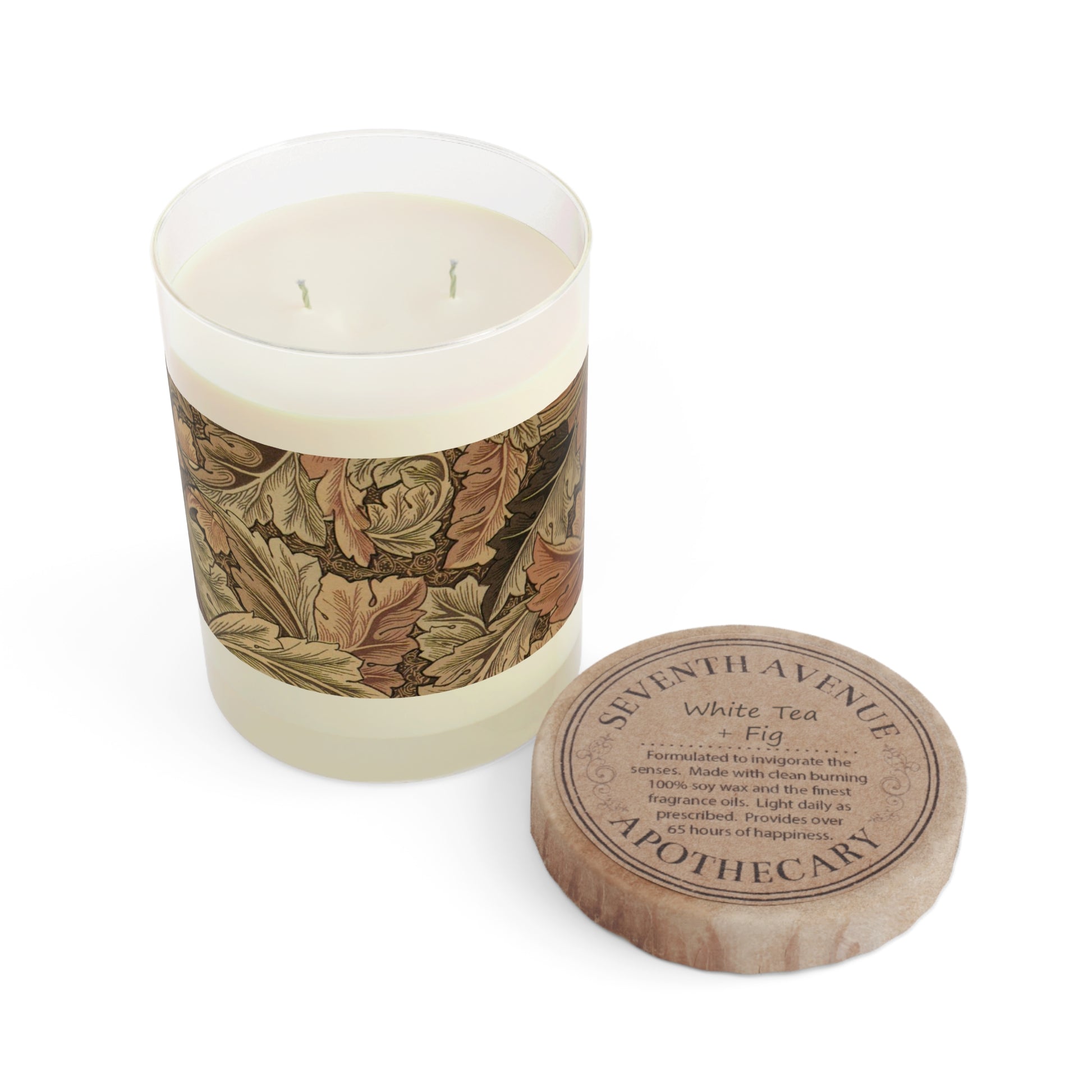 A brown luxury scented candle with a floral William Morris & Co patterned label, alongside a brown cardboard lid with text. The candle is placed in a clear glass jar.