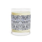 Candle with a decorative label on a white background
