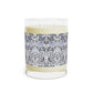 Candle with a decorative label on a white background