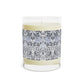 Candle with decorative label on a white background