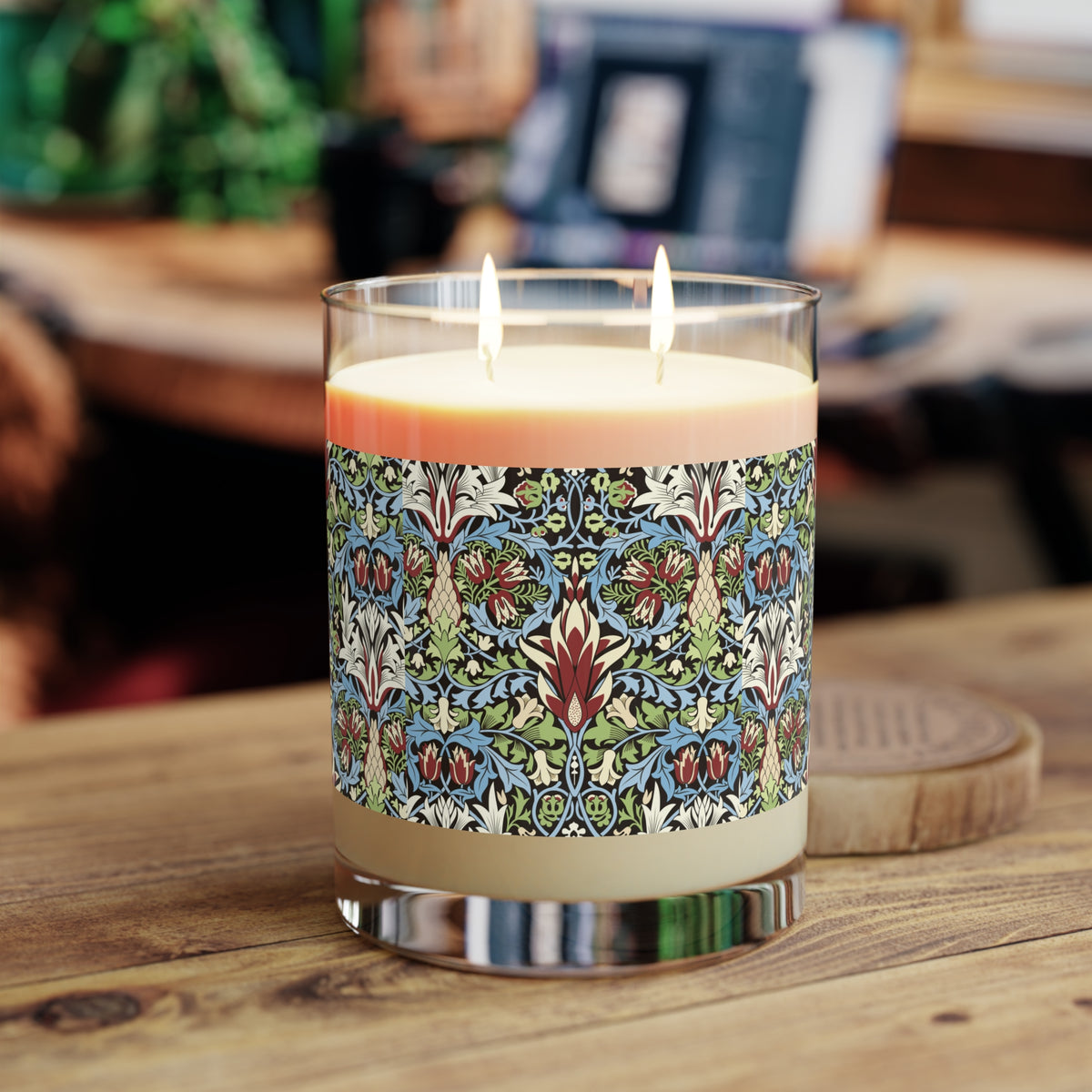Luxury Scented Candle in a glass container with two cotton wicks in a pattern by William Morris  & Co called Snakeshead Collection. Blue, red, white and green