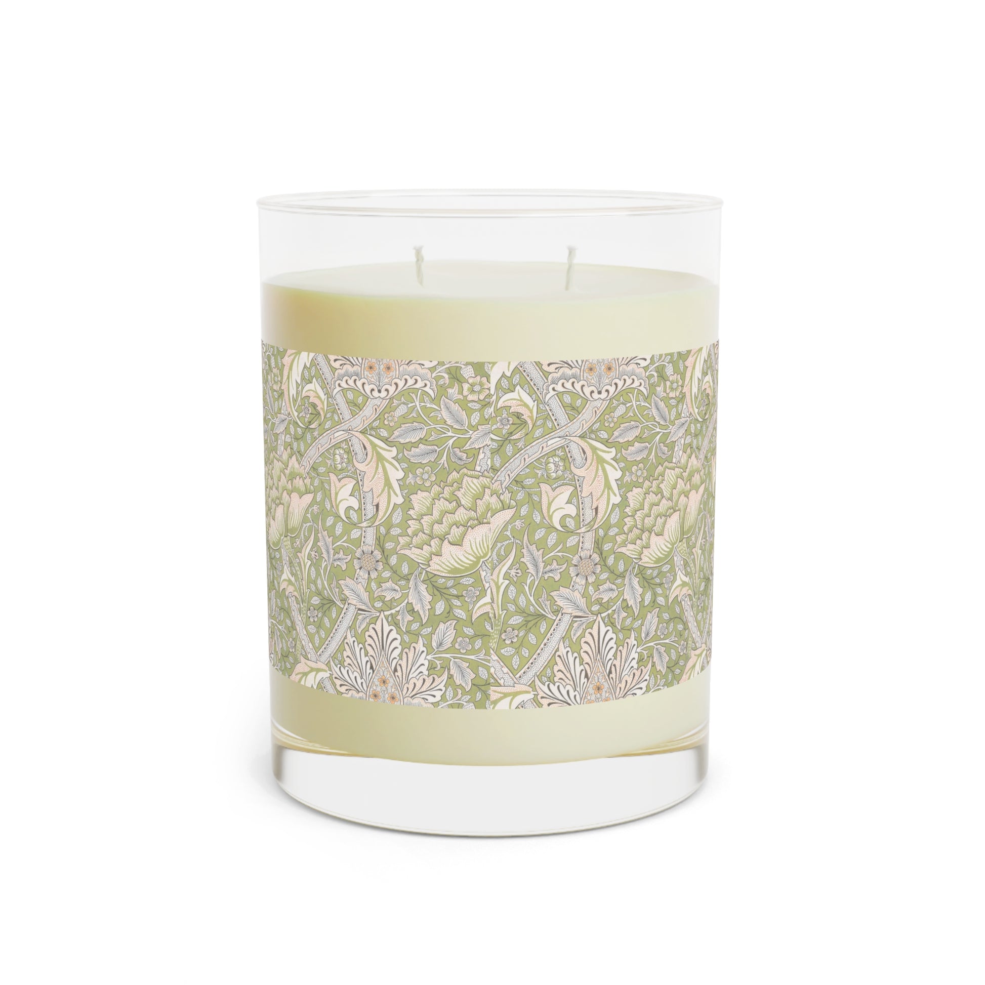 A luxury scented candle with a green and brown William Morris & Co floral patterned wrap around it, labeled 'Brook' from the Windrush Collection. The candle is in a clear jar with a brown cardboard lid.